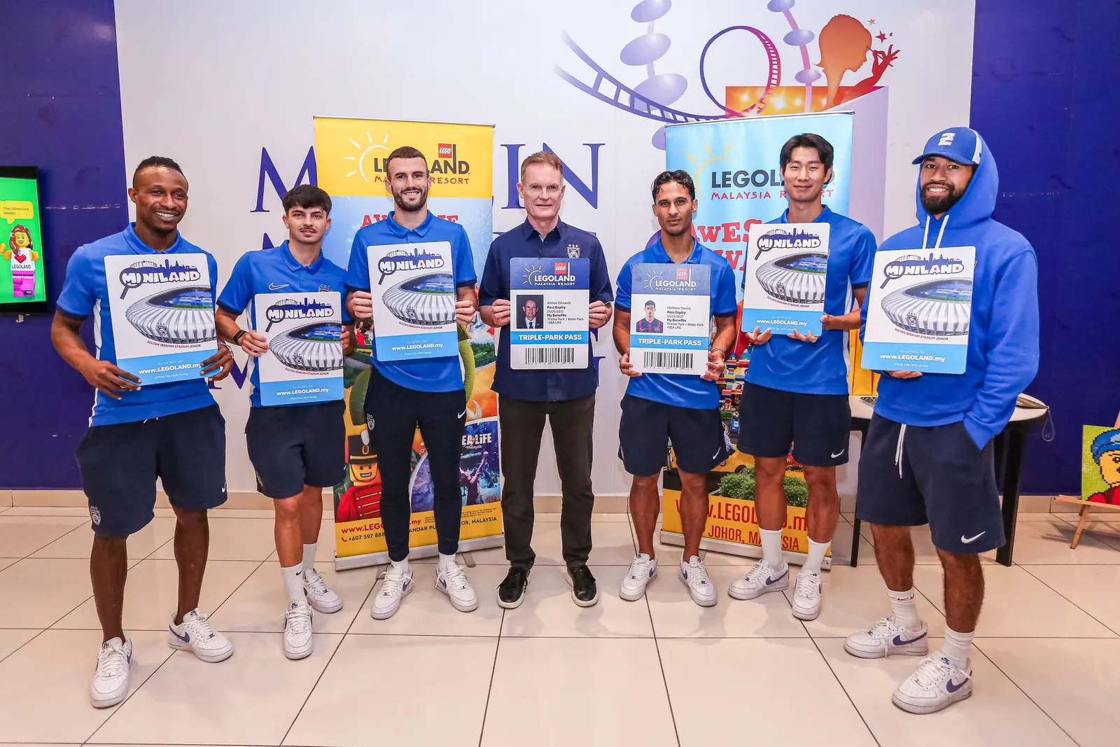 Players of Johor Darul Ta'zim F.C. showcase the special edition “Southern Tigers” LEGOLAND annual pass.